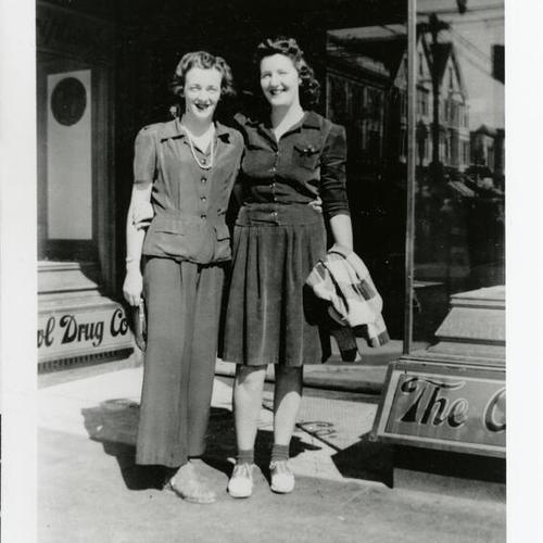 [Sisters Dorothy and Patsy standing in front of Owl Drug Store on Mission Street]