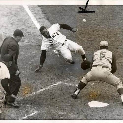 [Willie Mays sliding into home plate]