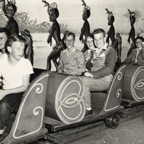 [Group of boys on a ride at Playland at the Beach]