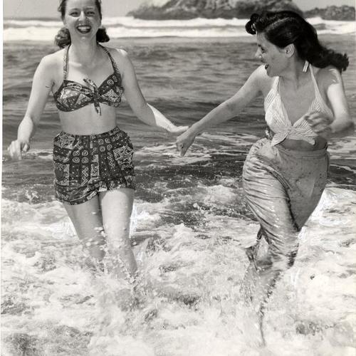 [Lotte Paalman and Louise Palmieri frolicking in the surf at Ocean Beach]