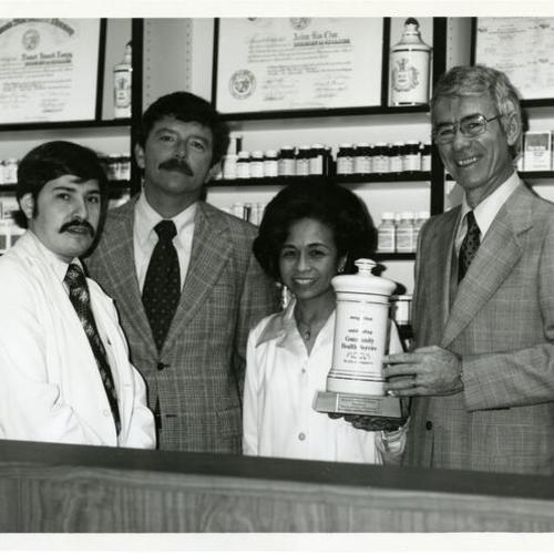 [Lolita receiving an award for Community Health Service at Kaiser Hospital where she worked as a pharmacist]
