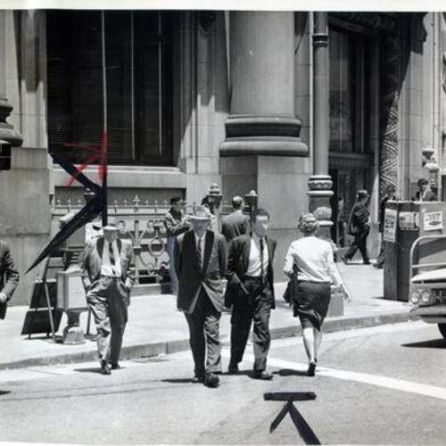 [Pedestrians crossing the street near a Wells Fargo Bank on Market Street]