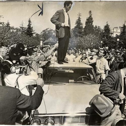 [Philosophy student Mario Savio addressing campus crowd from the top of a police car]