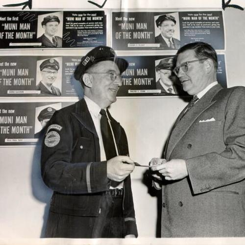 [Philip Landis presenting Joseph P. Sullivan with a check for being the "Muni Man of the Month"]