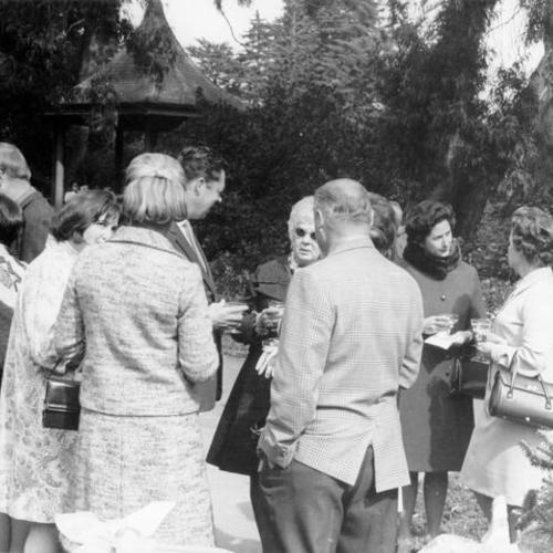 [People drinking cocktails and mingling during the Golden Gate Park Centennial]