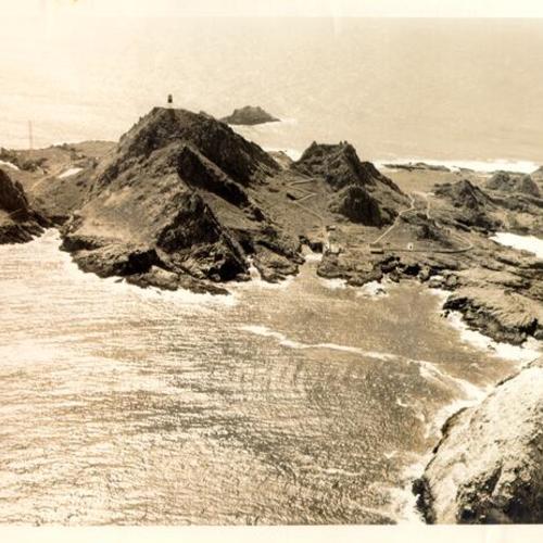 [Aerial view of Farallon Islands showing lighthouse in distance]