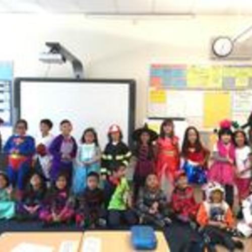[1st grade class with teacher at Longfellow Elementary during Halloween party]