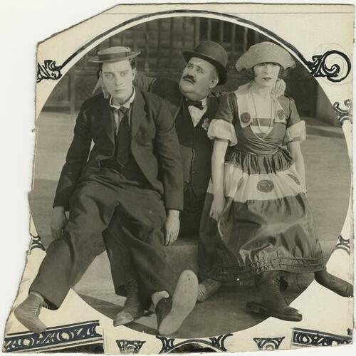 Buster Keaton (left), Joe Roberts, and Virginia Fox in silent film "Cops"
