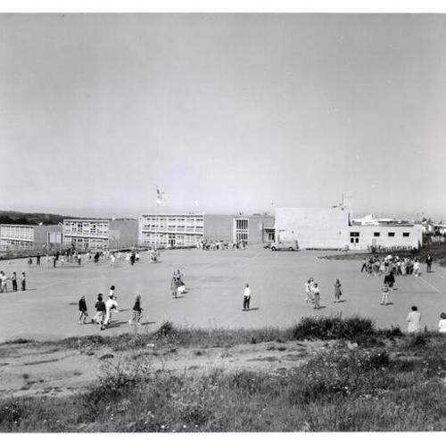 [Students playing in playground at Lakeshore School]