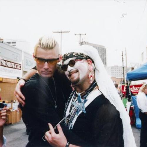 [Performance artist Robby D. with friend at Up Your Dore Alley Fair in 1994]