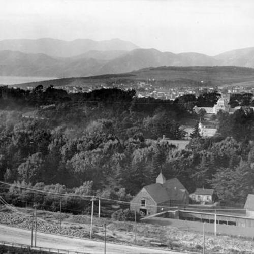 [View of Golden Gate Park with stables in foreground]