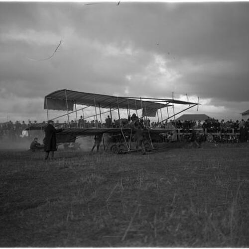 Louis Paulhan biplane crew at Tanforan racetrack stadium