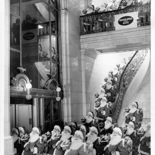 [Santa Claus displays for a Christmas Club membership drive in the lobby of Crocker-Anglo Bank's One Montgomery Street branch]