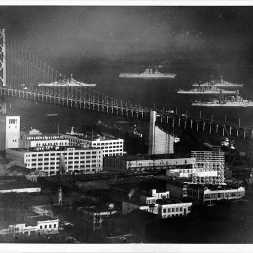[U.S. Navy aircraft carrier and four battleships set anchor beside Bay Bridge]
