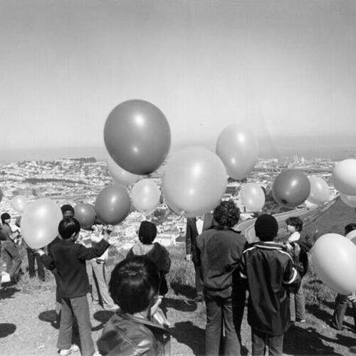 [Paul Revere School students launching balloons from Bernal Heights]