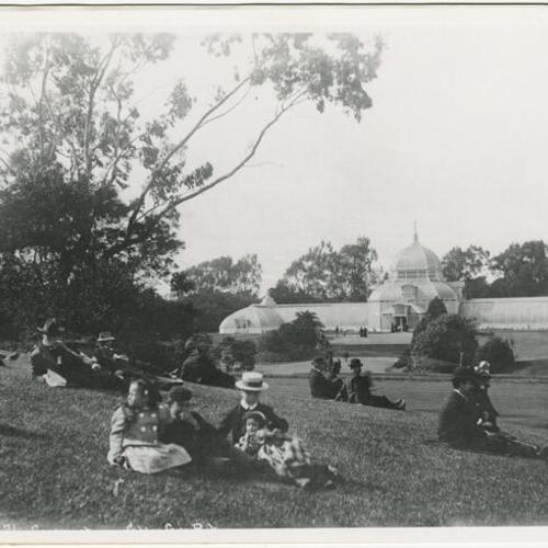 [People relaxing on lawn across from the Conservatory of Flowers in Golden Gate Park]
