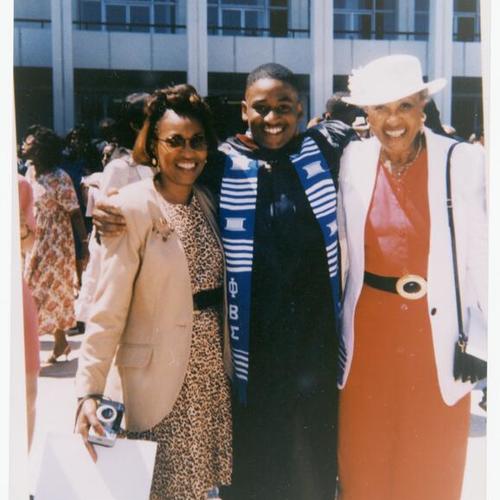 [Damon's graduation form Clark University in 1994 with his mother and grandmother]