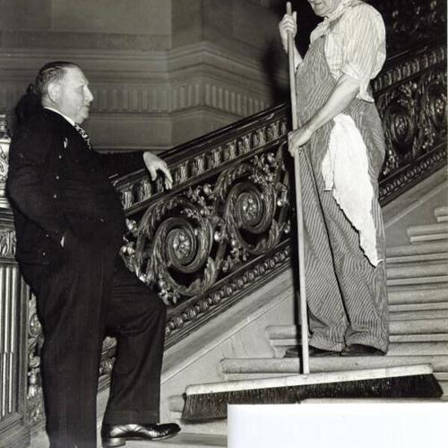 [Henry Viner chatting with Albert Remy on the staircase of the Rotunda, City Hall]