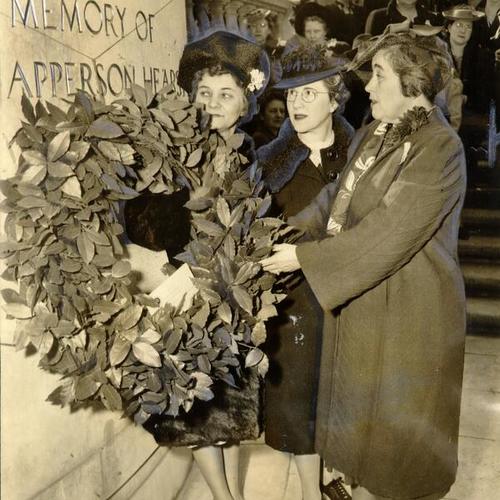 [Mrs. Charles Hengel, Mrs. Julian D. Cohn and Mrs. George Beanston placing a wreath on the monument to Phoebe Apperson Hearst in Golden Gate Park]