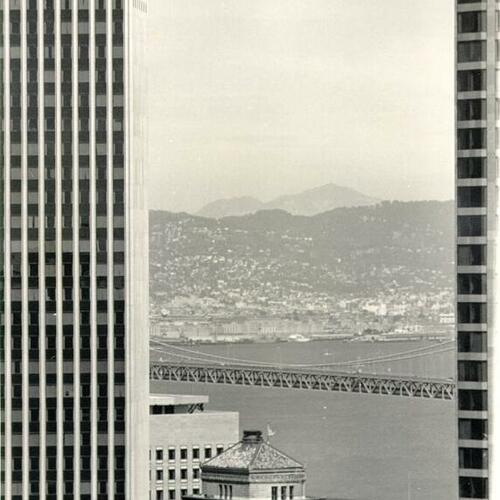 [View East from St. Francis Tower showing the sides of Wells Fargo (left) & Crocker Building (right), Mt. Diablo (background)]