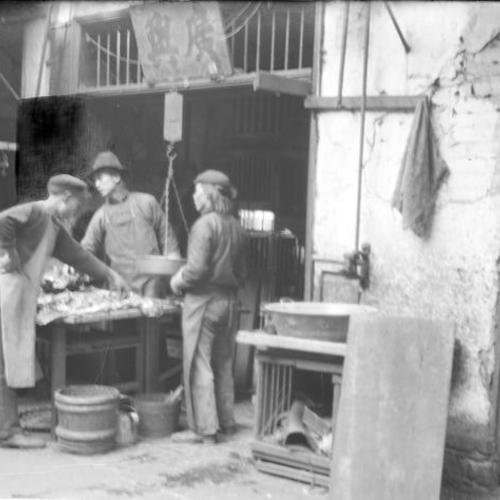 Three people at fish market