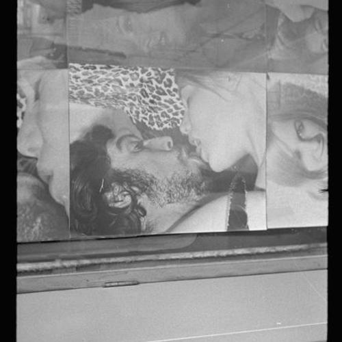Detail view of Gayety Theatre display window photo collage of people in sexual poses