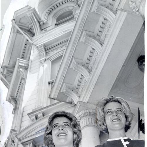 [Barbara and Phyllis Bronson standing in front of the apartment house at 2355 Washington Street where they lived]