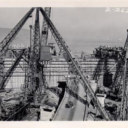 [Completion of concrete pier supporting most westerly tower of the suspension sector of San Francisco-Oakland Bay Bridge off the Embarcadero]
