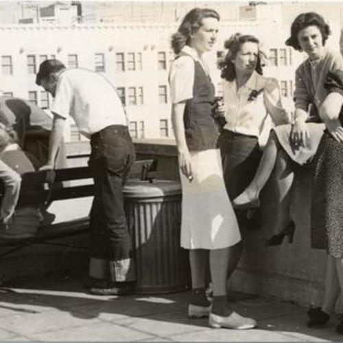 [Students taking a break on the balcony of a building at San Francisco State College]