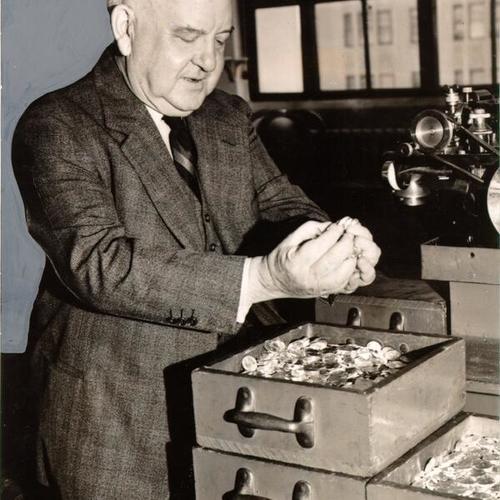 [Peter J. Haggerty, Superintendent of the U. S. Mint in San Francisco, with a box of coins made for China]