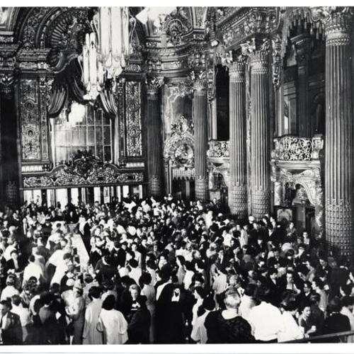 [Crowd inside of the Fox theater lobby]