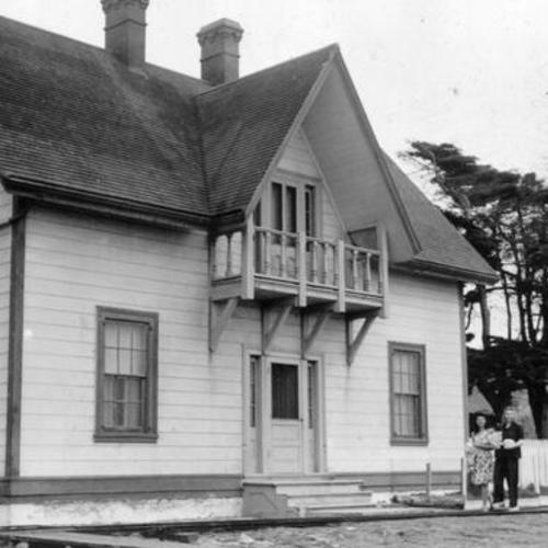 [Sara Hewitt and Betty Jeanne Barnes in front of one of the homes on an island in the Farallones]