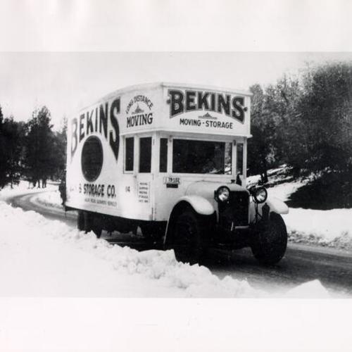 [Driver Bill Emerson driving a Bekins Van and Storage through Donner Summit]