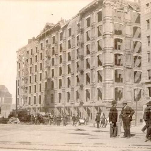 [Ruins of the Palace Hotel at Market and New Montgomery streets, with Lotta's Fountain in right foreground]