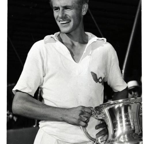 [Art Larsen holding trophy from Lawn Tennis Association]