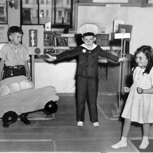[Steven Frleta, Robert Lagarrigue and June Knight performing in a traffic safety playlet at Starr King Elementary]