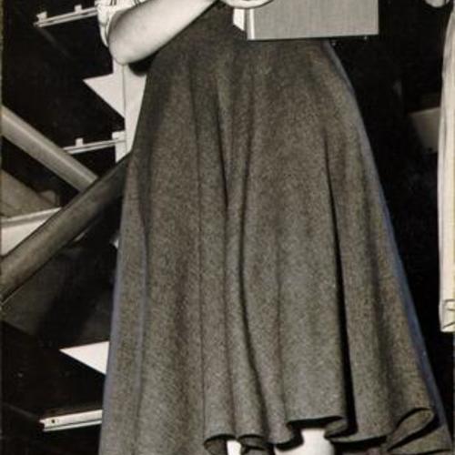 [Library employee Dorothy Shoemate descending a flight of stairs in the stacks at the Main Library]