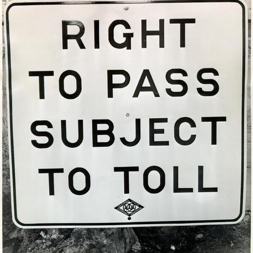 [Sign warning drivers they must pay toll to cross the San Francisco-Oakland Bay Bridge]
