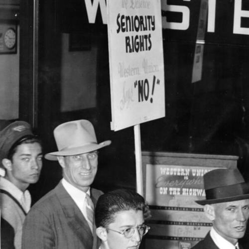 [Harry Bridges, marching in a picket line during a strike of Western Union operators and messengers]