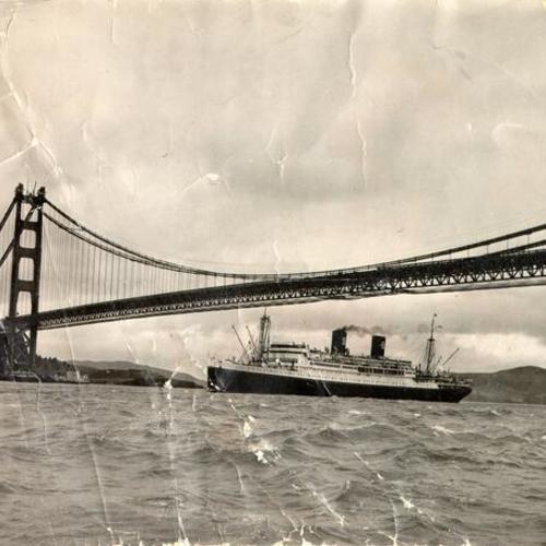 [Ship passing underneath the Golden Gate Bridge]
