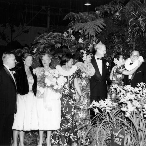 [Governor Brown and his wife receive flowers from Hawaiian queens]