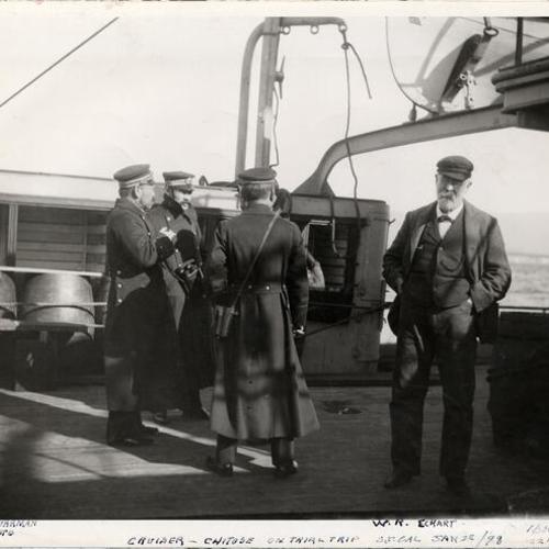 [William Roberts Eckart and several other men standing on the deck of the cruiser Chitose]