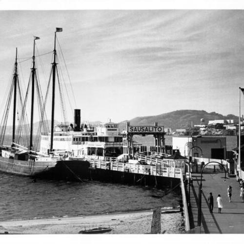 [Entrance to the Hyde Street Pier with the ferry Eureka and the schooner Thayer docked at the pier]