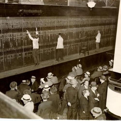 [Traders watching the quotation board at the brokerage house of McDonnell & Co., 633 Market Street ]