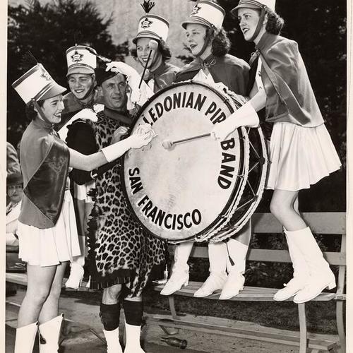 [Drummer Ed Ross assisted by five members of the Victoria, British Columbia, Girls' Drill Team, Golden Gate International Exposition on Treasure Island]