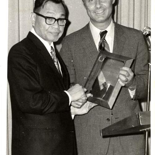 [Mayor George Moscone (right) and Philippine Consel General Sabalones]