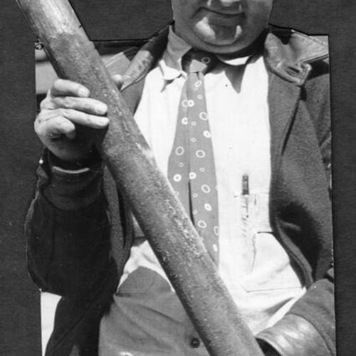 [C.P. Winters, Official of Pacific Bridge Company, holding a bomb]