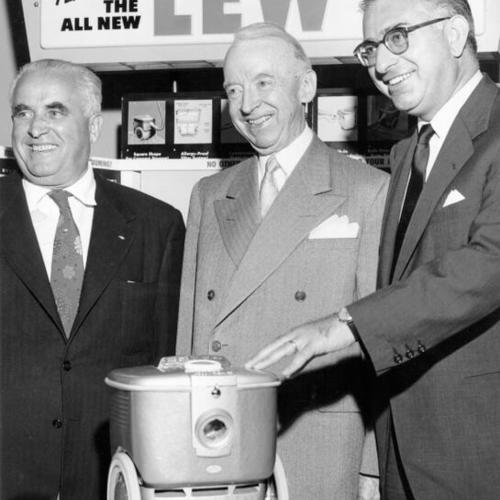 [Thomas Brooks with the new 1956 Lewyt vacuum cleaner at the firm's regional sales meeting]
