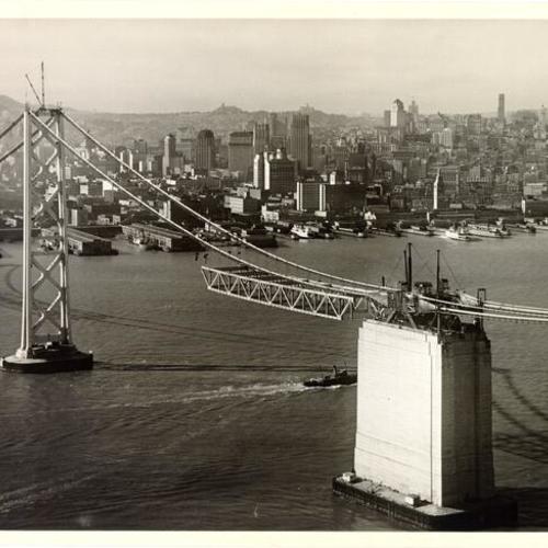 [Aerial view of San Francisco-Oakland Bay Bridge span under construction]