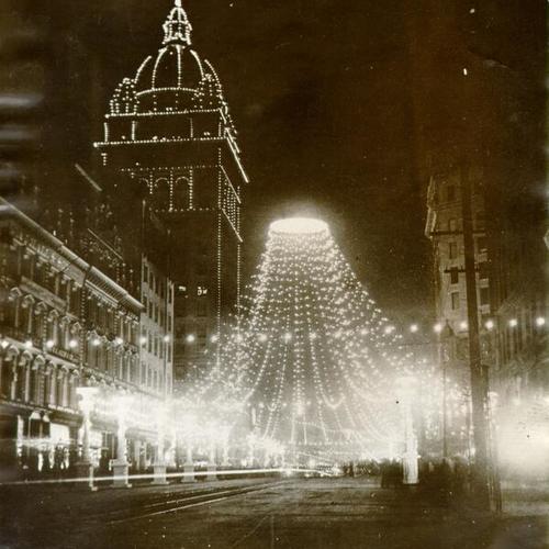 [Nighttime view of Knights of Pythias decorations and Spreckels Building on Market Street]